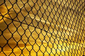 Fence Wire Mesh at orange sky