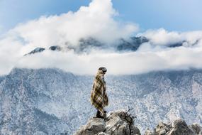 Nomad on the beautiful mountains in white clouds, under the blue sky
