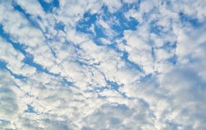 Beautiful, blue sky with clouds in sunlight