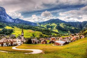 Beautiful and colorful Alta Badia, with buildings, on the Dolomites, in Italy