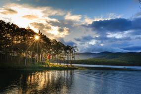 Beautiful shore with the forest, in Dalat, Vietnam, at beautiful sunset in the sky