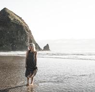 girl at beach and Mountain Hill