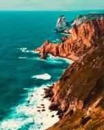 Beautiful and colorful coast of Portugal with mountains and waves