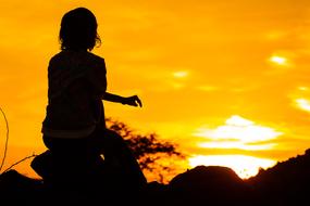 Silhouette of Girl at Orange sunset