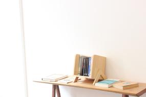 Bookcase with books on wooden bench