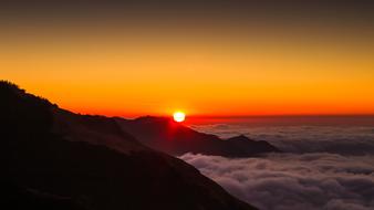 Beautiful Poonhill mountains in Nepal, among the clouds, at colorful and beautiful sunrise