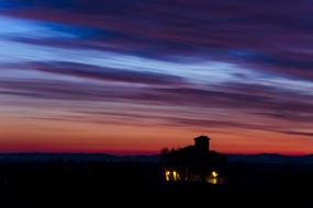 castle on the background of the red-purple night sky