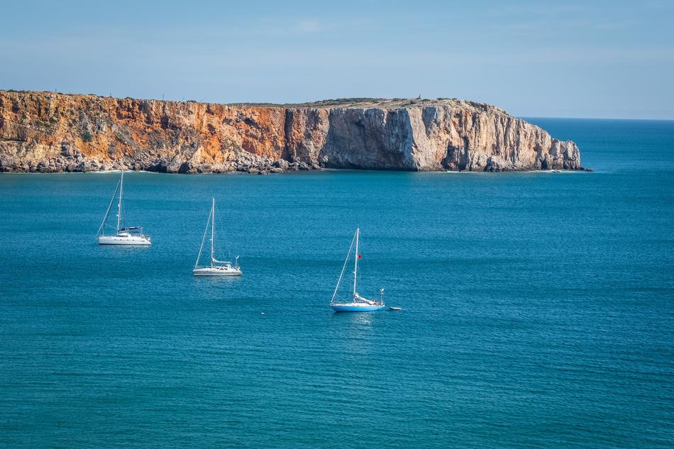 boat on the sea near the rocks