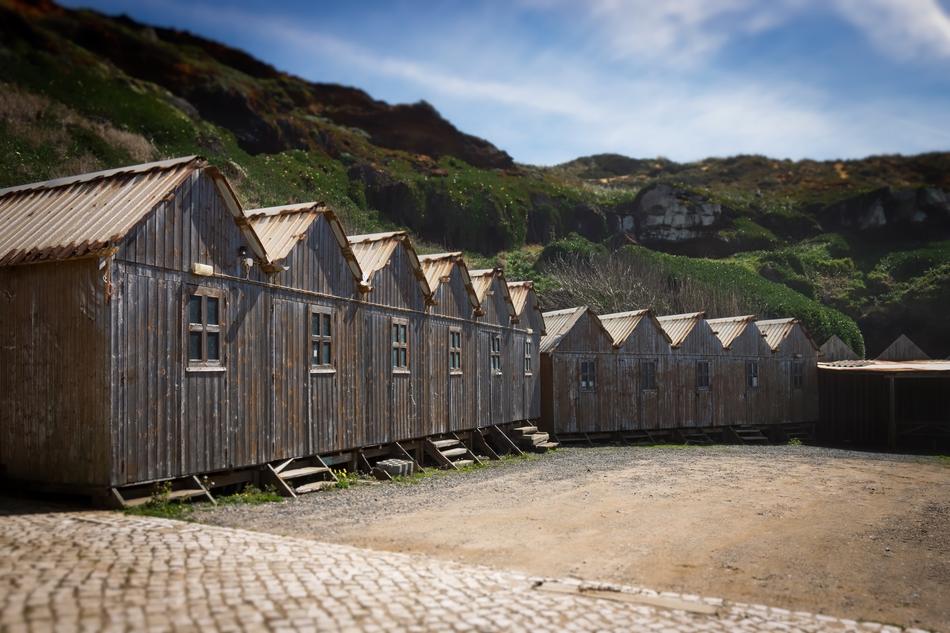 Beautiful landscape with the fishing huts, near the colorful and beautiful hills, in Portugal
