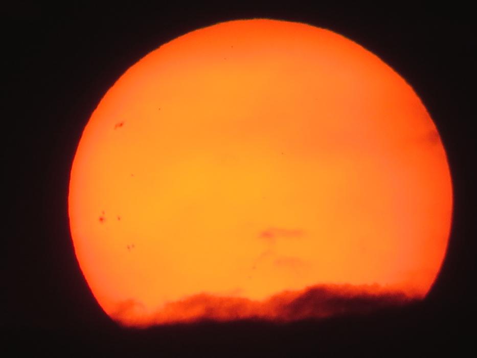 setting sun on black as background