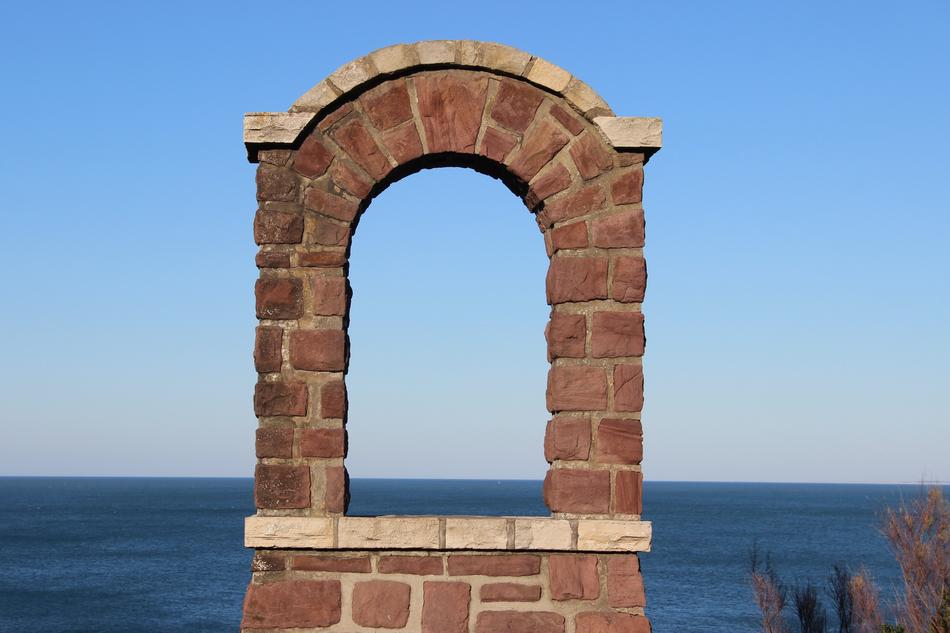 brick window overlooking the ocean in biarritz, France