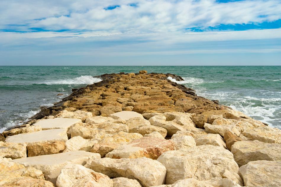 pier with stones near the sea in spain