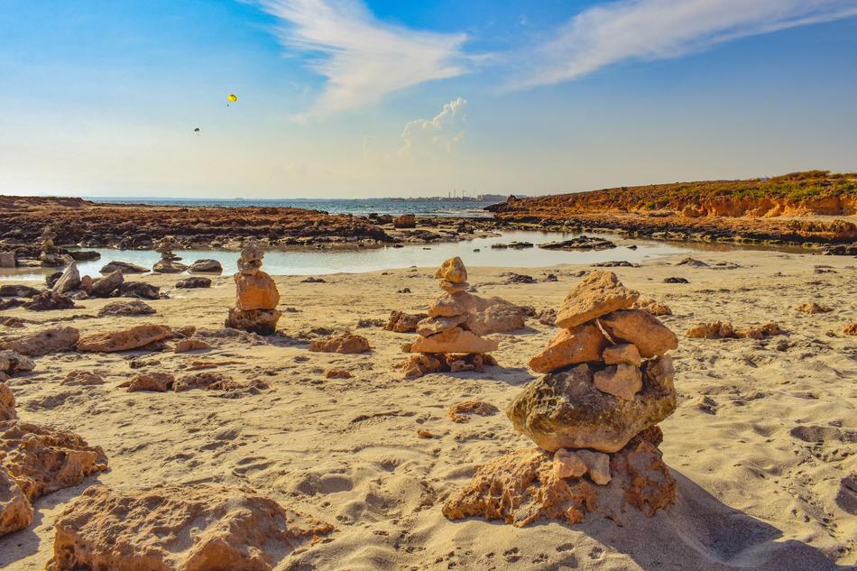 stone towers on the beach by the sea