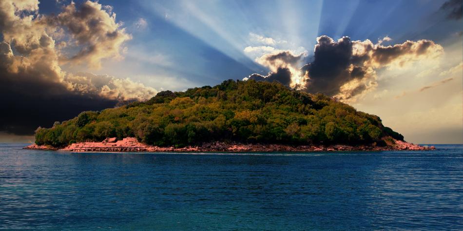 sunset in the clouds over the island
