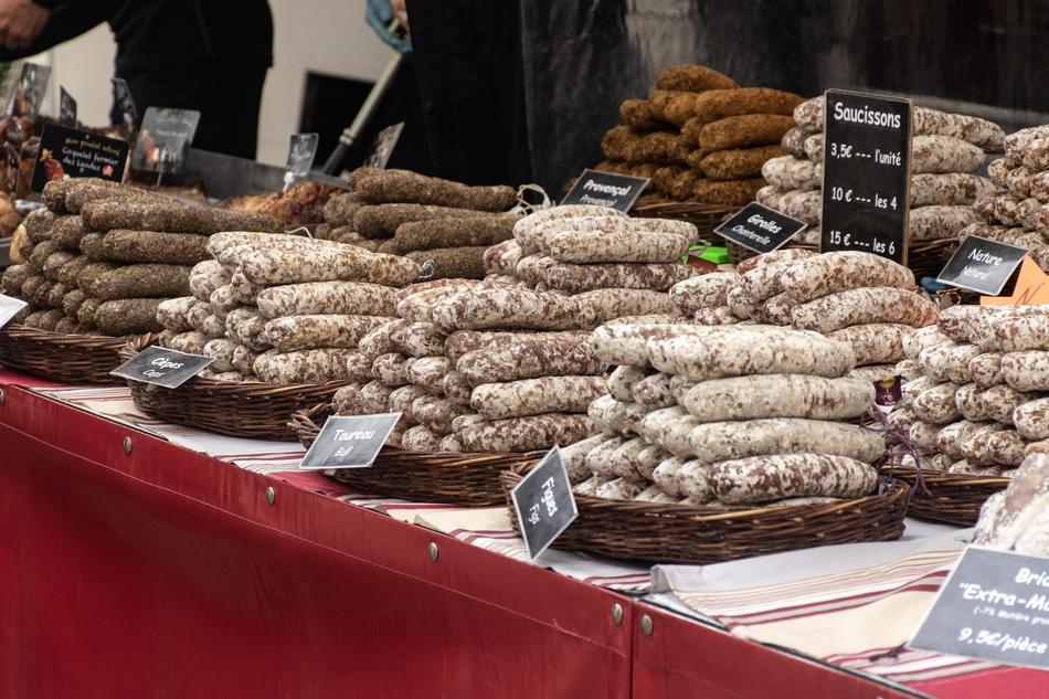 Colorful sausages with signs, at the Market Day in Forcalquier, France