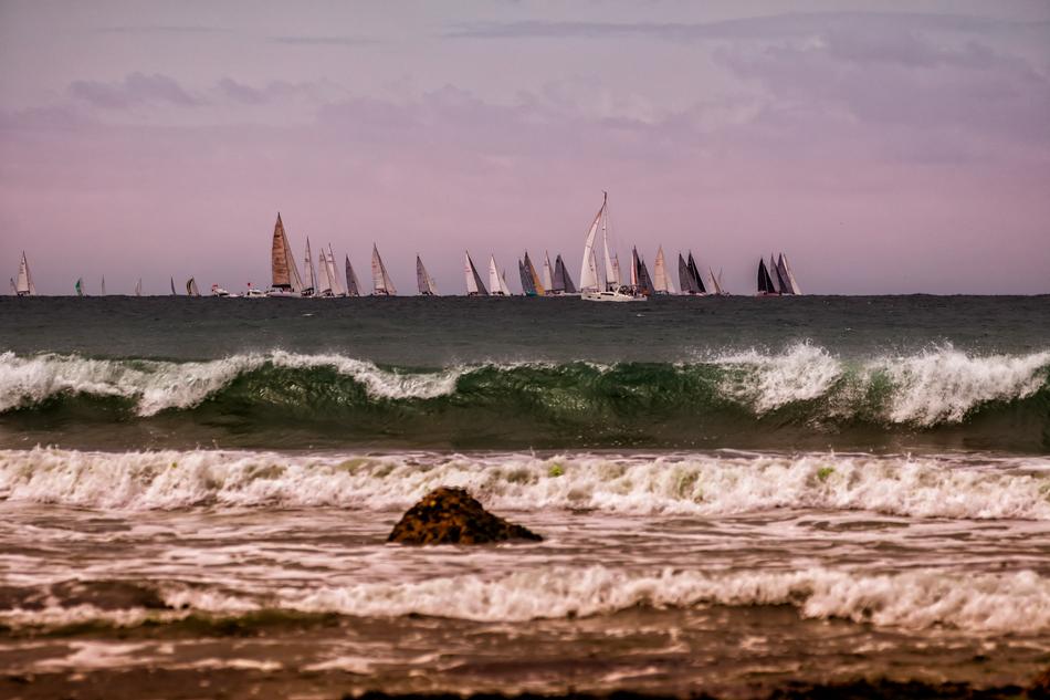 boats at sea during medium waves