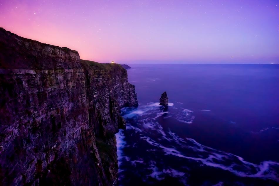 Beautiful coast of Ireland, with cliffs, at colorful and beautiful, gradient sunset