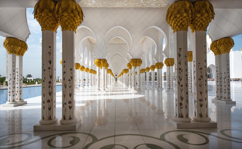 Beautiful and colorful mosque with columns, in sunlight, in Abu Dhabi, UAE