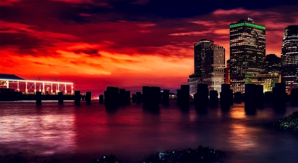 harbor against the backdrop of a colorful sunset in New York