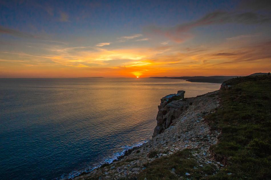 panoramic view of the coastline at sunset in dorset