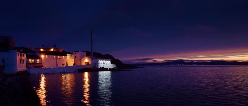 Bowmore Distillery on seaside at dusk, uk, Scotland