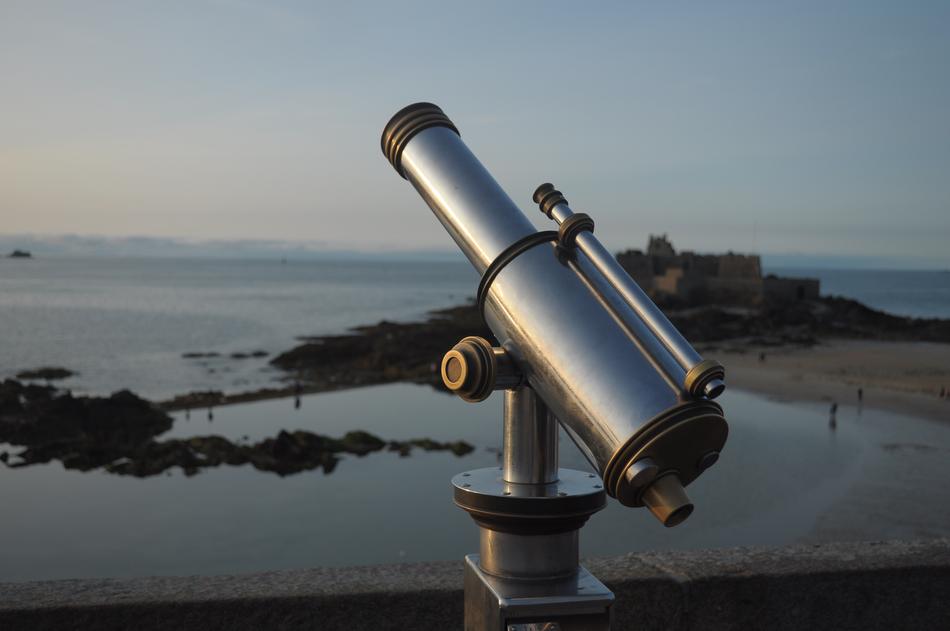 telescope on the background of the sea at dusk