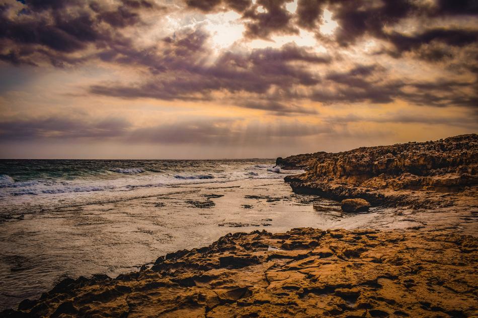 gray clouds over the coast of cyprus at dusk
