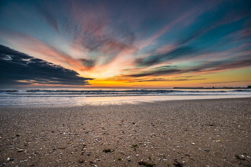 Beautiful beach of the Black Sea in Romania, at colorful and beautiful sunrise