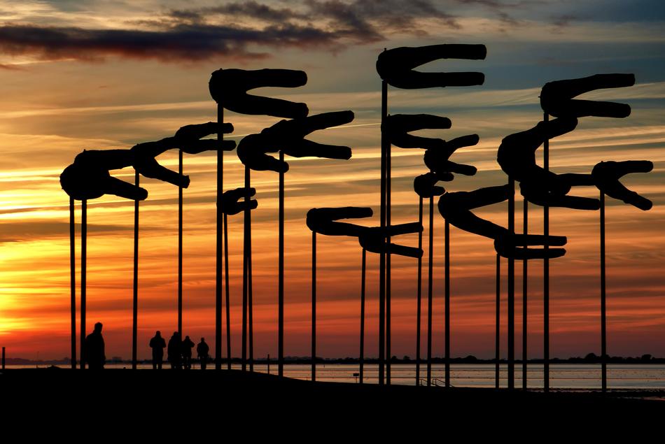 art objects during sunset near the north sea