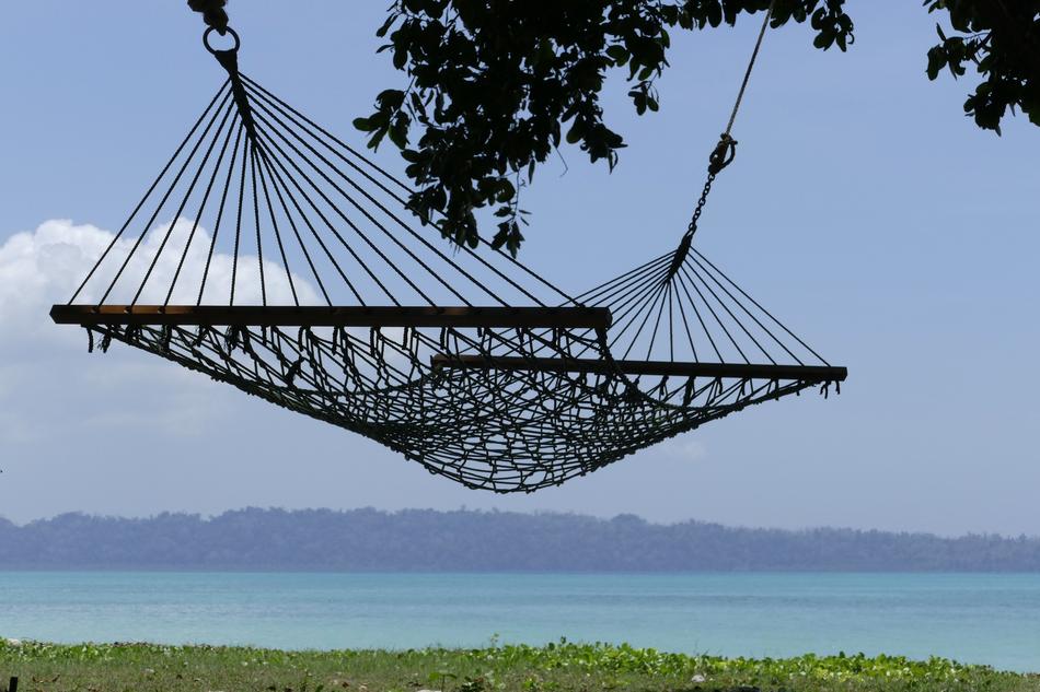 hammock on a tropical island against the background of the evening sky