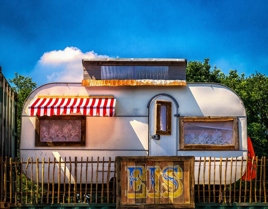 Colorful mobile home with decorations, among the plants in Germany, at the Parookaville