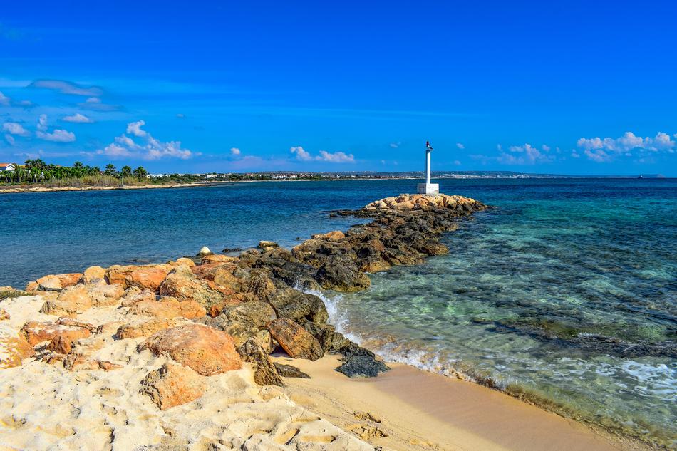 lighthouse on the beach with stones in cyprus