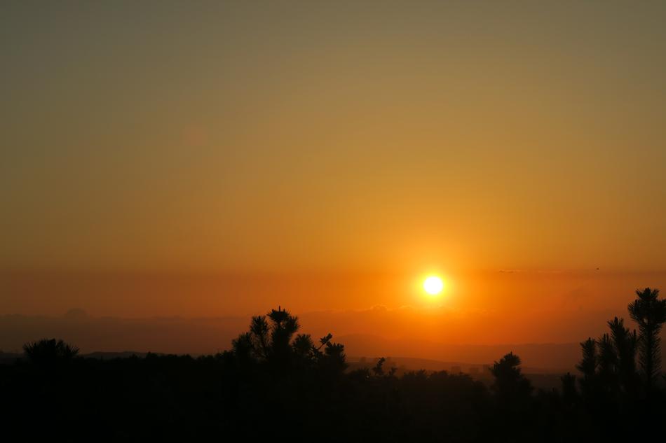 calm Sunset over dark rural landscape