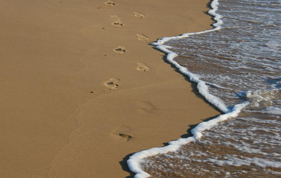footprints on the shore of the Strand coast