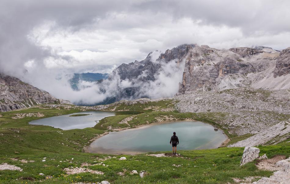 tourist near the lake in the dolomites
