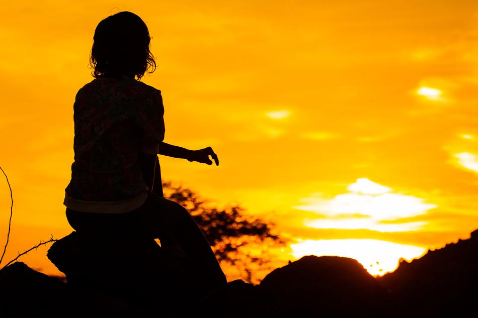 Silhouette of Girl at Orange sunset
