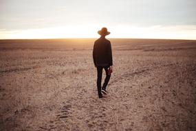 Man Guy on dried grass field