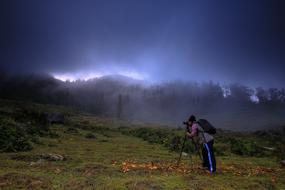 Photographer at foggy Mountain