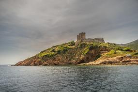 distant view from the water on the coast of sardinia