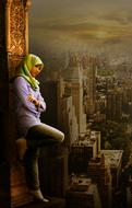 girl in a headscarf posing against the backdrop of a modern city
