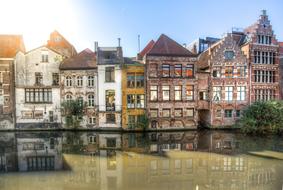 historic buildings on the canal in ghent, Belgium