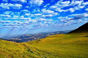 Beautiful landscape of the colorful KaÃ§kars mountains with plants, in Turkey, under the blue sky with clouds
