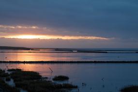 Beautiful coast of the North Sea, at colorful and beautiful sunset among the clouds
