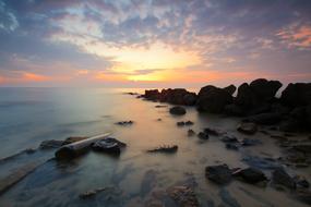 stones on the coast in the water in the morning