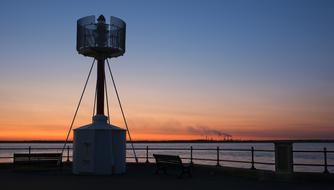 Lighthouse at Sunset Evening