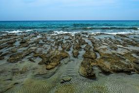 sandy beach with rock formations