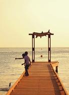 Children fishermen on Beach Sea