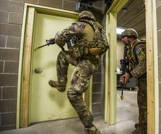 Soldiers with equipment, on the training in the building