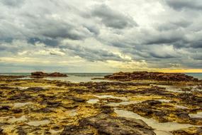 Rocky Coast and Sky Clouds