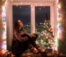 Girl sitting near Window